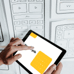 Photo of a data visualization consultant helping on a business intelligence dashboard project
