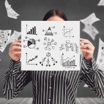 Image of woman holding up a infographic from our data visualization course