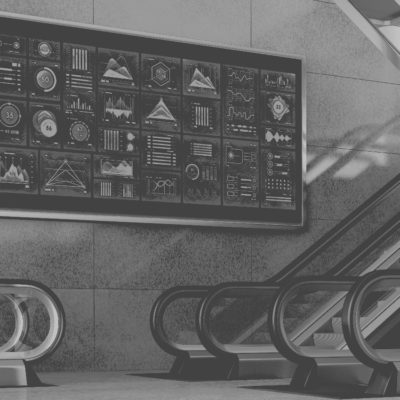Data-Visualization workshop training image of a presentation of charts next to a company escalator